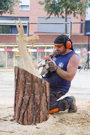 Wood sculpture competition with chainsaw, on July 27, 2019, in Alella, Barcelona, Spain.のeditorial素材