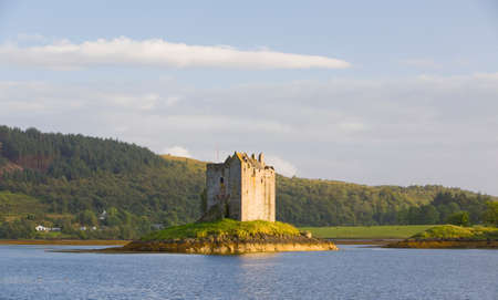 Stalker Castle, a four storey tower house or keep picturesquely set on a tidal islet on Loch Laich,...