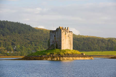 Stalker Castle, a four storey tower house or keep picturesquely set on a tidal islet on Loch Laich, Port Appin, Argyll, Scotland.のeditorial素材