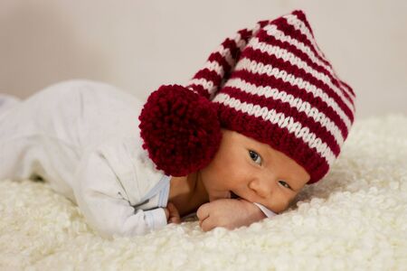 Newborn baby in red headingの写真素材