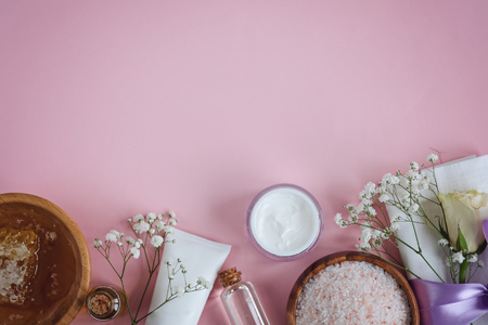 Spa natural skin care products background, cosmetic products - creative layout on pink backgroundの写真素材