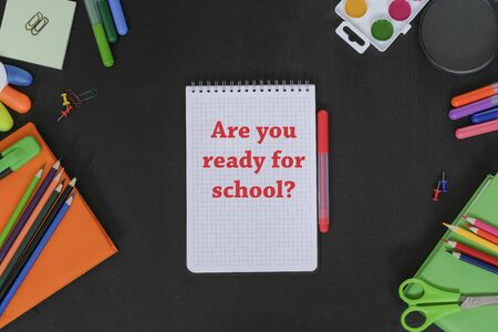 School supplies on black board background. Ready for scool concept. View from aboveの写真素材