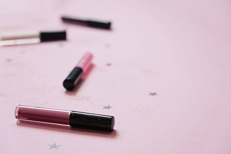 Glitter lip balm on pink background, Space for textの写真素材