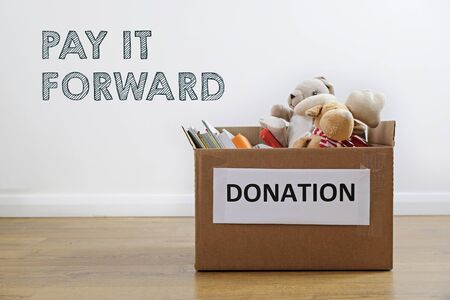 Donation concept: box full of books and toys. Pay it forwardの写真素材