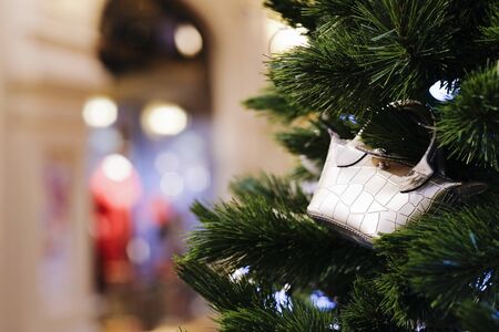 Christmas tree decoration shopping bag with blurred bokeh backgroundの写真素材