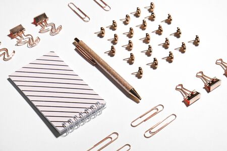 Modern geometric flat lay with office supplies, woman fashion workspace in gold colorの写真素材