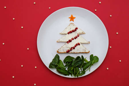 Creative edible christmas tree, food art. Food for kids and festive table. Tree made from bread with...