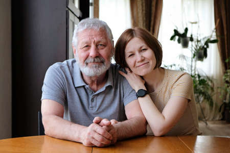 Happy senior elderly father grandfather and adult grown daughterの写真素材