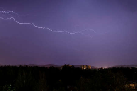 Thunderstorm lightning in the evening skyの写真素材