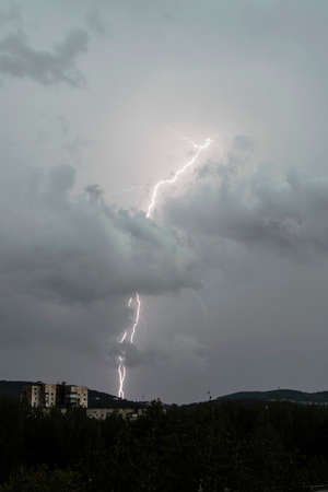 Thunderstorm lightning in the evening skyの写真素材