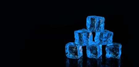 six blue ice cubes on black backgroundの写真素材