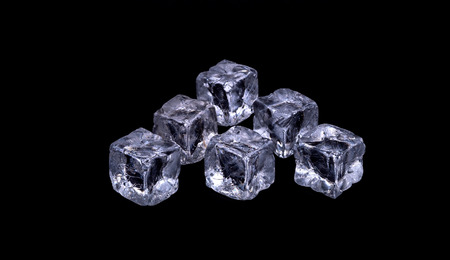 Ice cubes on black backgroundの写真素材
