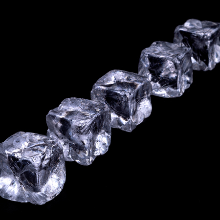 Ice cubes on black backgroundの写真素材