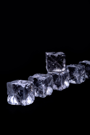Ice cubes on black backgroundの写真素材