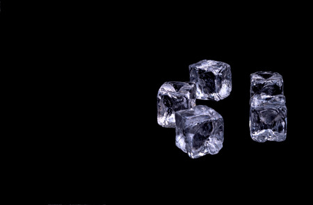 Ice cubes on black backgroundの写真素材