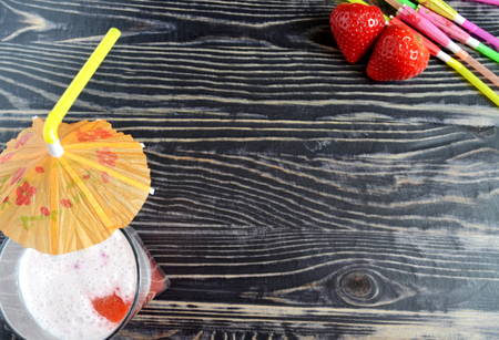 Summer cocktail with berries on dark backgroundの写真素材