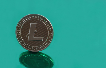Litecoin coins on green backgroundの写真素材