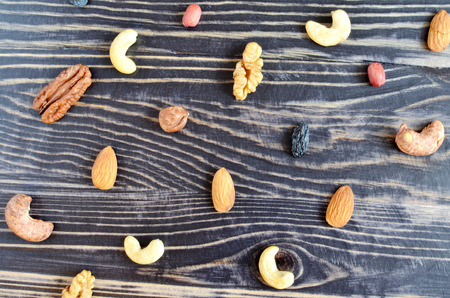 almond cashew hazelnut and dark nuts on dark background top viewの写真素材