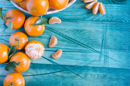 Tangerines with leaves close-up, copy spaceの写真素材