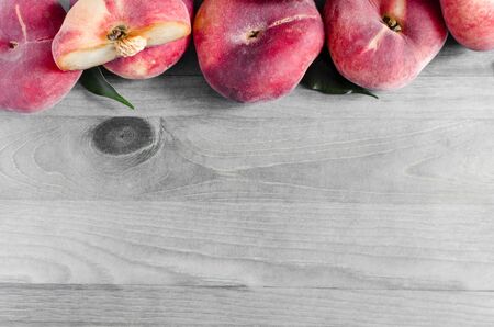 flat peaches on wooden background Fig peaches Kopi spaceの写真素材