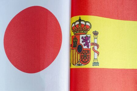 national flags of Japan and Spain closeupの写真素材