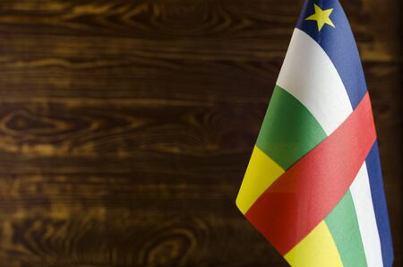 Fragment of the flag of the Central African Republic in the foreground space for text blurred...