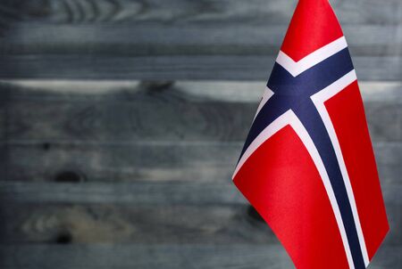 Fragment of the flag of the Kingdom of Norway in the foreground blurred background copy spaceの写真素材