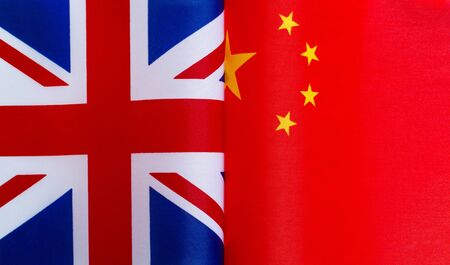 fragments of national flags of great Britain and China close-upの写真素材