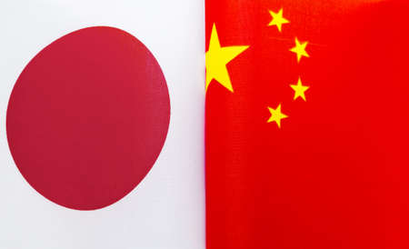 fragments of national flags of Japan and China close-upの写真素材