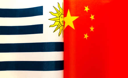fragments of national flags of Uruguay and China close-upの写真素材