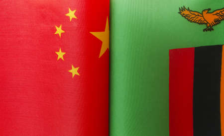 fragments of the national flags of China and the Republic of Zambia close upの写真素材