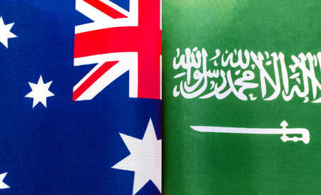 fragments of national flags of Australia and the Kingdom of Saudi Arabia close upの写真素材