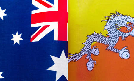 fragments of national flags of Australia and the Kingdom of Bhutan close up