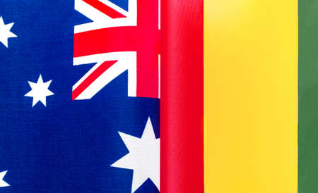 fragments of the national flags of Australia and the Republic of Guinea close upの写真素材