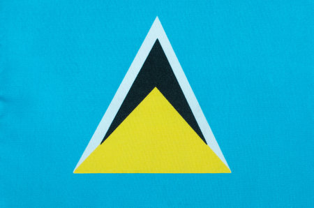fabric of the national flag of Saint Lucia close-upの写真素材