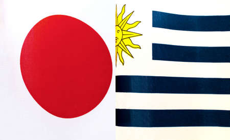 fragments of the national flags of Japan and Uruguay close-upの写真素材