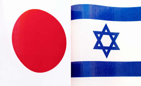 fragments of the national flags of Japan and the State of Israel close-upの写真素材