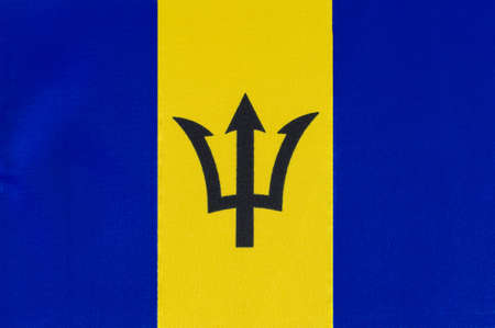National flag of Barbados close-up on fabric base