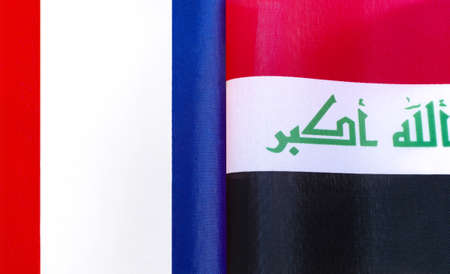 fragments of the national flags of France and Iraq close-up
