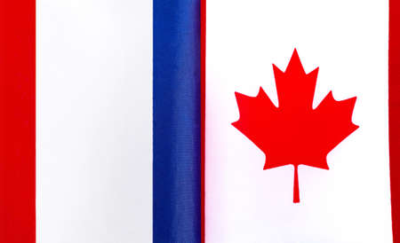 fragments of the national flags of France and Canada close-upの写真素材