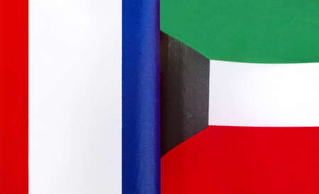 fragments of the national flags of France and Kuwait close-upの写真素材