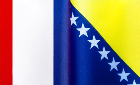 fragments of the national flags of France and Bosnia and herzegovina close-upの写真素材