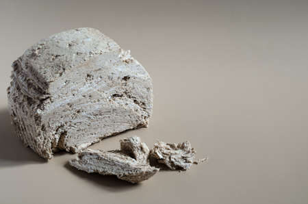 Peanut halva on a light brown background top view-side space for text. Halva oriental sweetsの写真素材