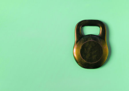 Dark brown chocolate mass in the form of a weight on a colored background close-up of the place...