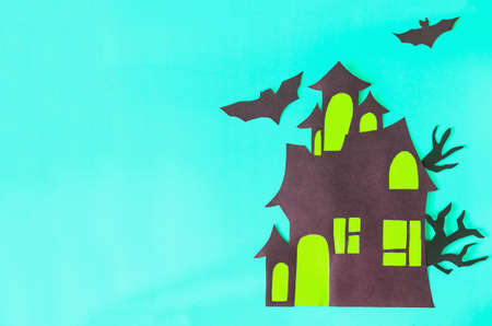 Flatley applique house of fear. A castle with yellow windows and bats on a blue background.の写真素材
