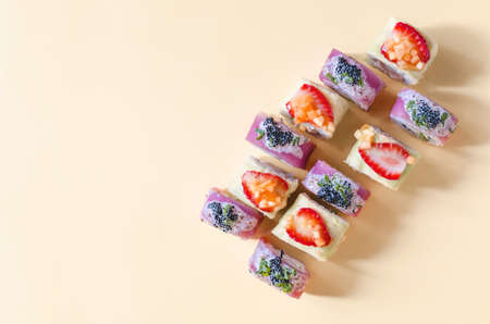 Bright rolls with seafood and berries on a light background of flats.の写真素材