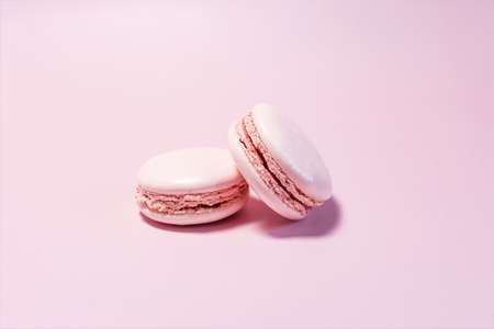 Macaroons of pink color close-up on a light pink background.の写真素材