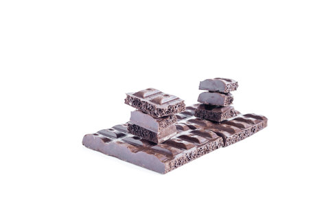 Pieces of airy chocolate on a light background, top view of the place for the text.の写真素材