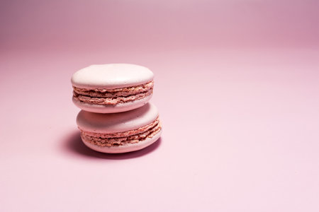 Macaroons of pink color close-up on a light pink background.の写真素材