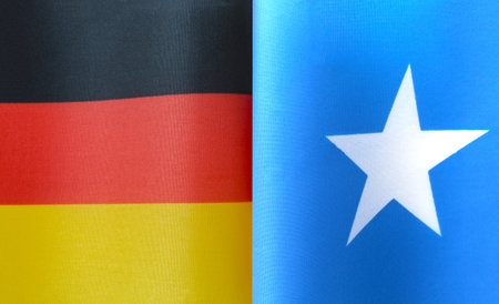 fragments of the national flags of Germany and Somalia in close-upの写真素材